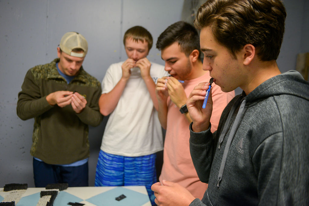 From right Justin Bruno, Jose Ayala, Daniel Binghan and Devin Callahan work on Delta Upsilon's pomp
